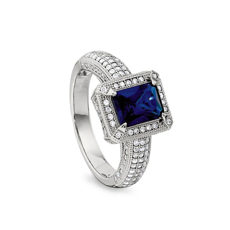 SapphireRings-Platinum Finish Sterling Silver Micropave Emerald Cut Synthetic Blue Sapphire Ring with Simulated Diamonds